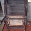 Underside is unpainted. It comprises a wooden frame with canvas stretched across it