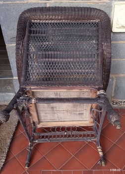 Underside is unpainted. It comprises a wooden frame with canvas stretched across it