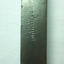 Maker's details are stamped into the handle