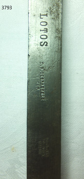 Maker's details are stamped into the handle