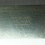 Maker's details are stamped into the metal