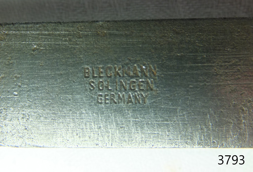 Maker's details are stamped into the metal