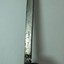 Marks are stamped along the edge of the handle