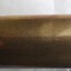 Engraved inscription in cursive script on the side of the telescope
