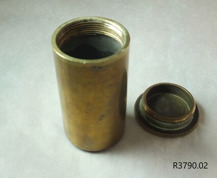 Top of base and bottom of lid have screw threads pressed in the metal surface