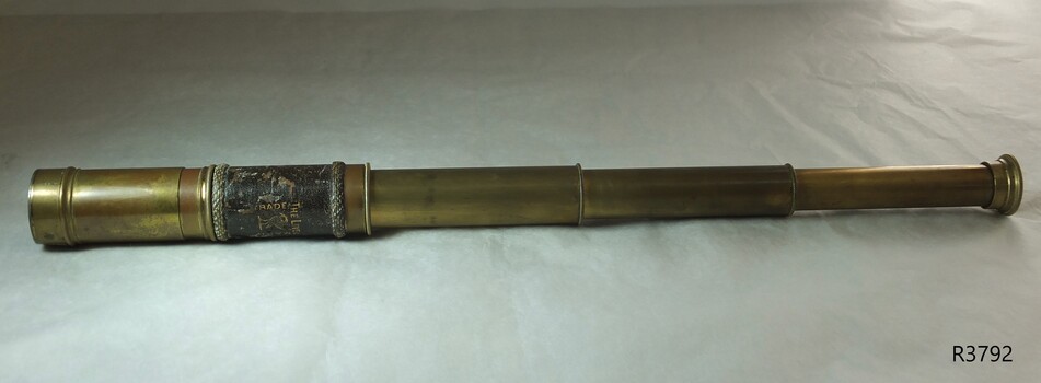 Brass telescope, three draw, with decorative leather hand grip