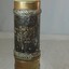 Image is stamped and embossed in gold. It has both text and an image of a bird.