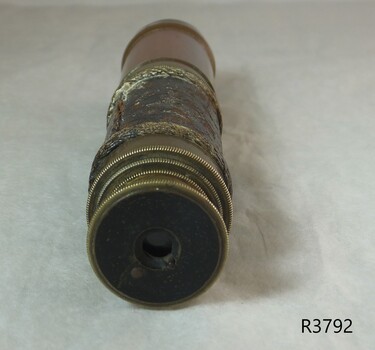 Eyepiece is closest to the viewer. Ridges of the sections can be seen.