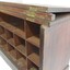 Cabinet door has two sets of 3 brass hinges to close it