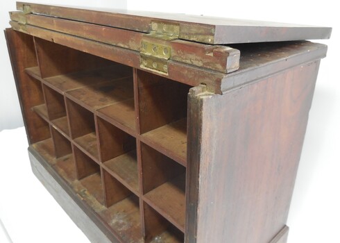 Cabinet door has two sets of 3 brass hinges to close it