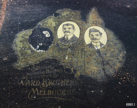 Decal is map of Australia with images of two men, and a blank where part of the decal has been removed