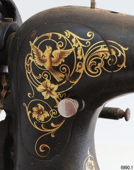 Decal is gold on black and had the image of a dove within it