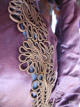 Fancy gold braid decorates the jacket