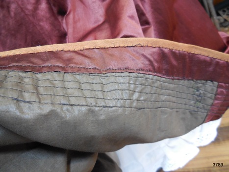 Hem is attached to pin-tucked lining for weight and reinforcing