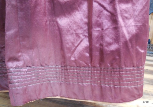Hem of skirt has rows of stitching through to lining, giving it weight