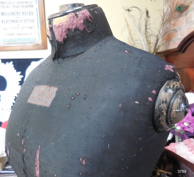 Mannequin is covered in dark coloured fabric
