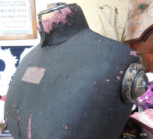 Mannequin is covered in dark coloured fabric