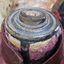 Neck area is filled in with wooden shape that has concentric rings