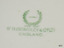 Green text and logo of the maker