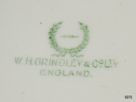 Green text and logo of the maker