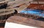 White figurehead on bowsprit above the bowsprit net and chains