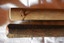 One end has threaded wire inserted through drilled hole, the other is shaped to give flat sides
