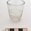 Medicine glass with scale and inscriptions