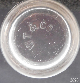 Inscriptions on base of glass