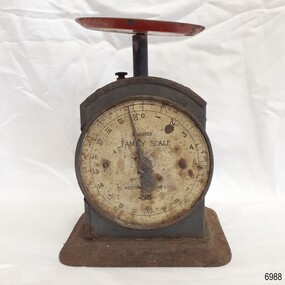 Scale has maker's details. A round dish is on the top of the scale.