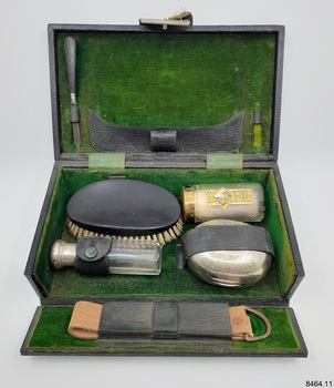 Green velvet-lined case with toiletries and equipment
