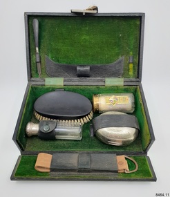 Green velvet-lined case with toiletries and equipment