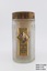 Textured glass bottle with gold-coloured metal lid and paper label fixed to one side