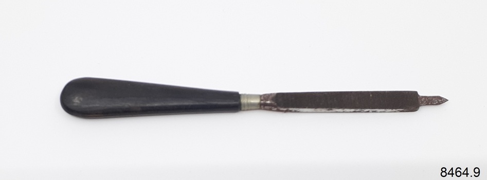 Nail file with ebonised handle