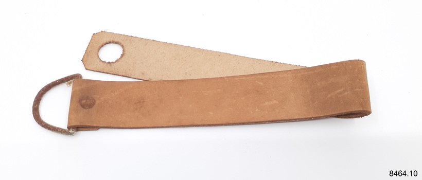 Strop has a D ring at one end and a punched hole ate the other