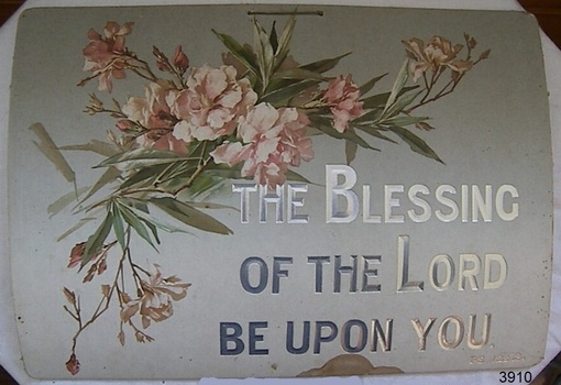 Floral design on grey background. Solver text embossed onto card.