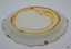 Oval plate has green maker's stamp. Surface has brown water stain, crazing, chips and a crack.