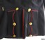 Back flat has red piping on edges, six brass buttons and a brass hook