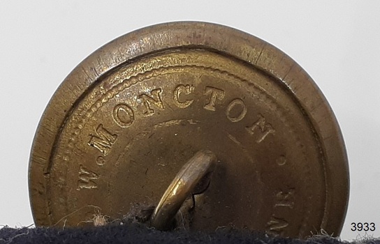 Impressed into back of button is the maker's name 'W. Moncton'