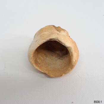 Opening of hollow pipe bowl has irregular edges, Inside surface is rough