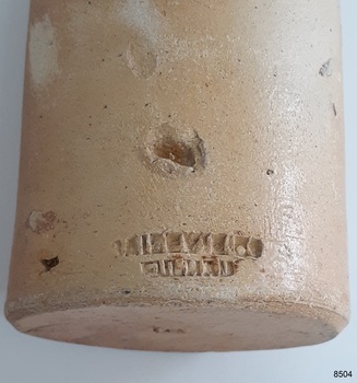 Inscription is impressed into the clay in two lines. There is a large chip above the inscription