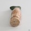 Round top of doll's leg is solid. It has a faint groove across the centre.