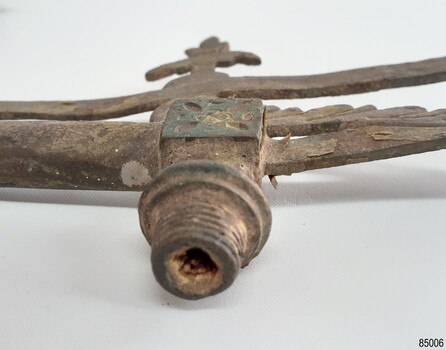 Gas pipe inlet joint is threaded and connects to a decorated cube joint that has green paint remnants