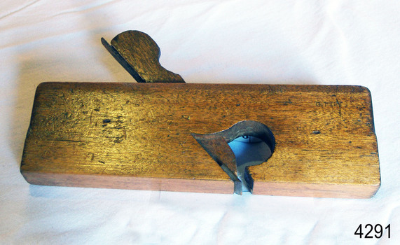 Wooden plane is very narrow and has inscription with owner's name