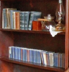 Book case containing a set of religious books