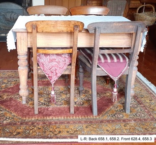 four chairs with squab cushions on them