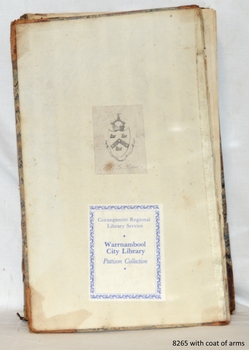 Inside cover there is a printed coat of arms and a printed sticker