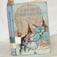 Blue covered book with illustrated front cover picturing a woman and two cildren