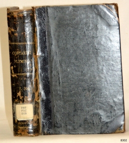 Black cloth hardcover book with embossed gold text on spine