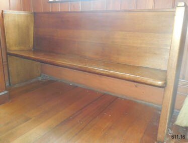 Made from solid wood in a simple design of a bench seat with backrest. The legs are an extension of the back and side panels.