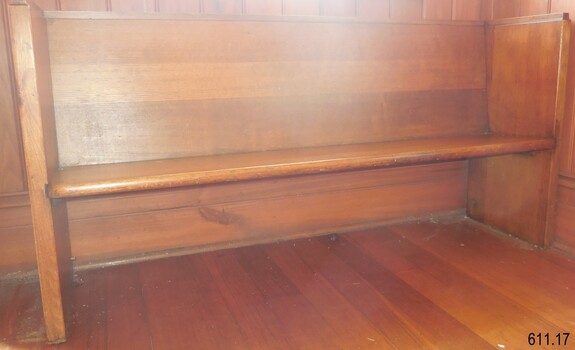 Made from solid wood in a simple design of a bench seat with backrest. The legs are an extension of the back and side panels.
